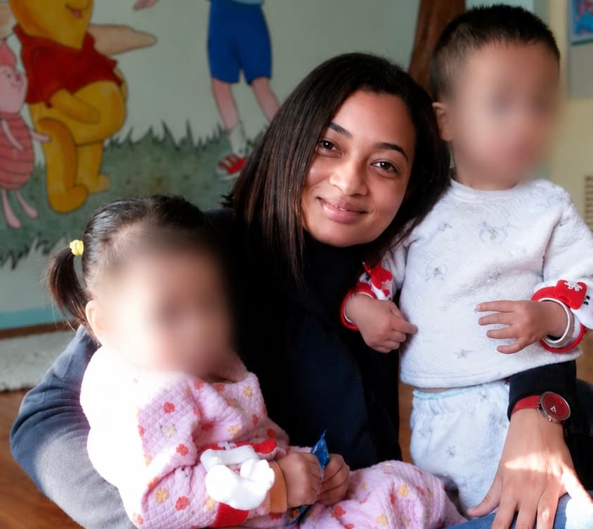 Annie Wong with children during charitable work in China
